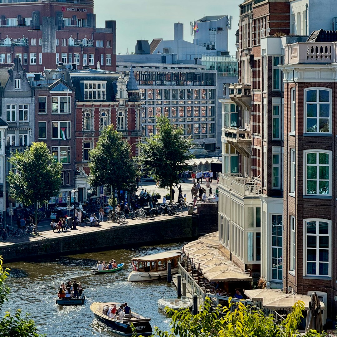 Boats on a canal in front of historic buildings