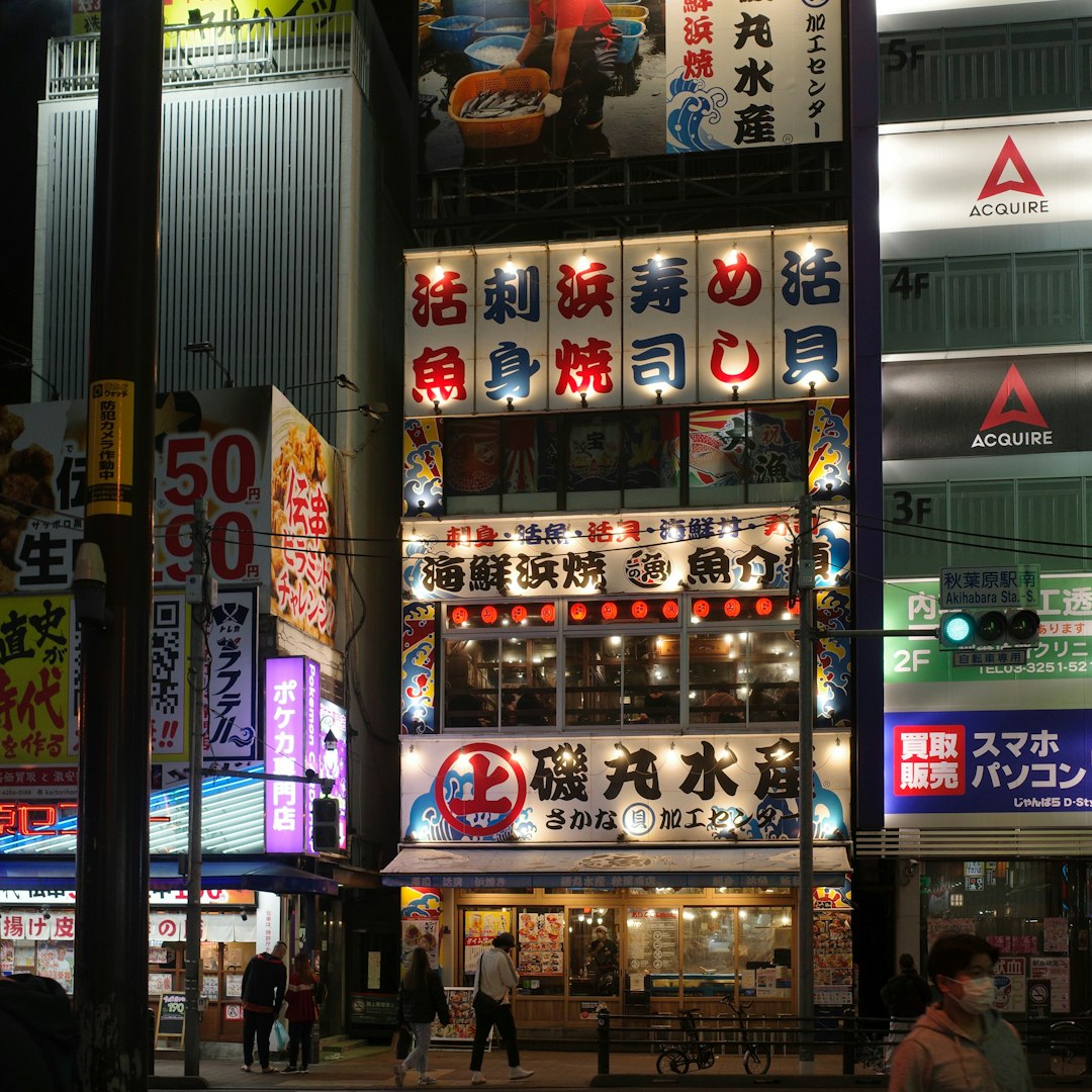 Brightly lit japanese street signs at night