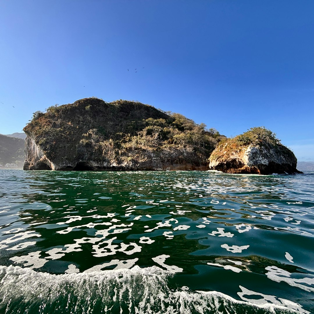 Rocky islands rise from the sparkling blue ocean