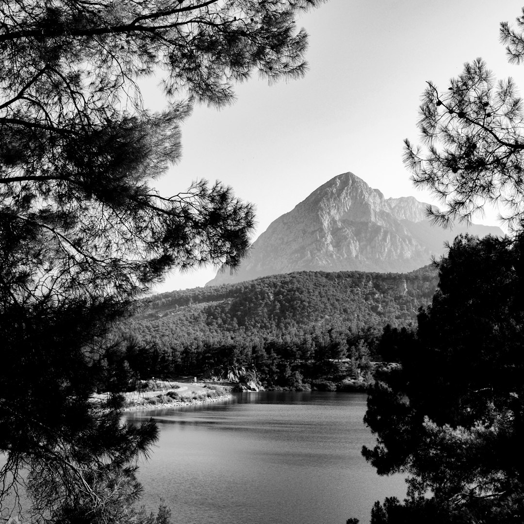 Framed view of a mountain peak over a lake