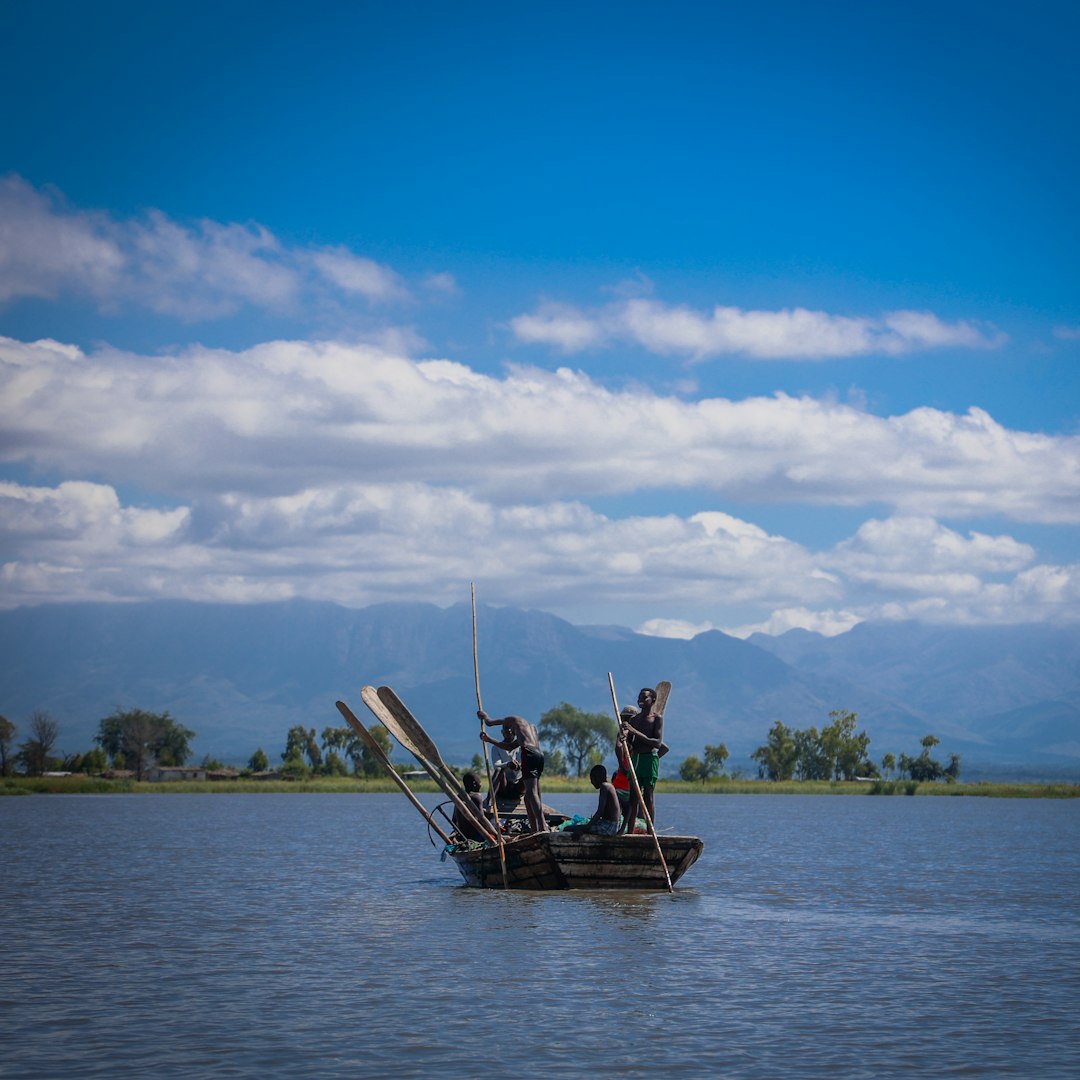 People on a boat in a large body of water