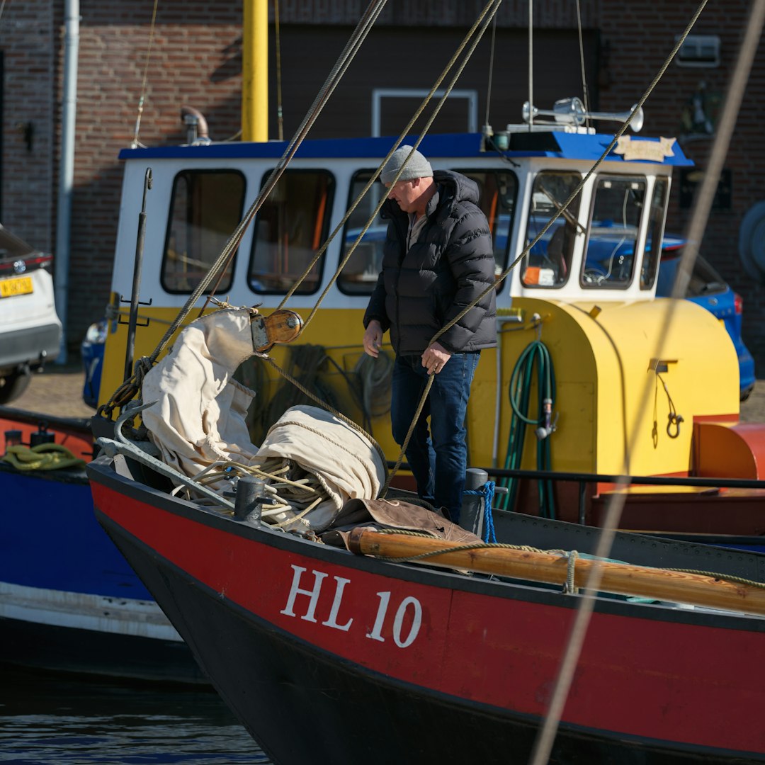 Man on a boat preparing for a sail