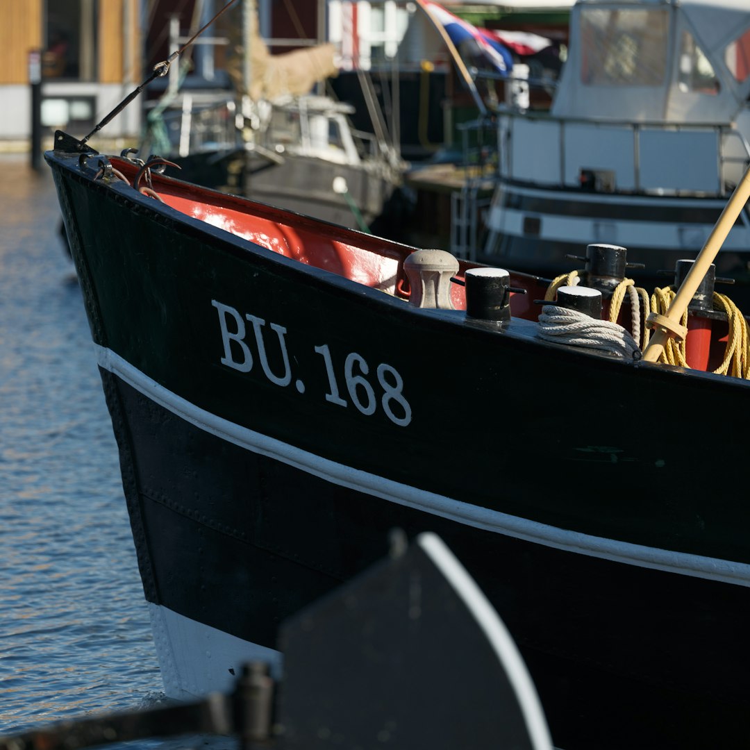 A dark boat labeled