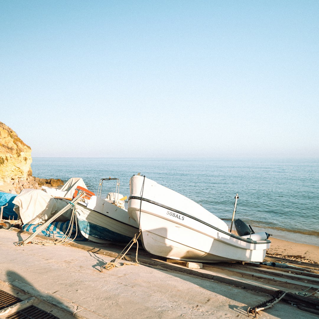 A couple of boats sitting on top of a beach