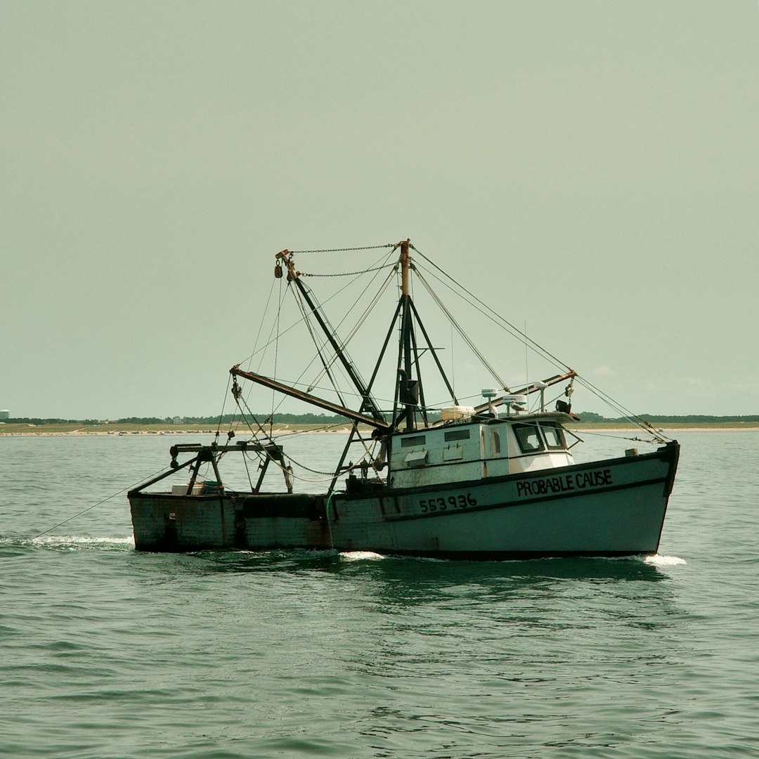 A fishing boat sails on the water