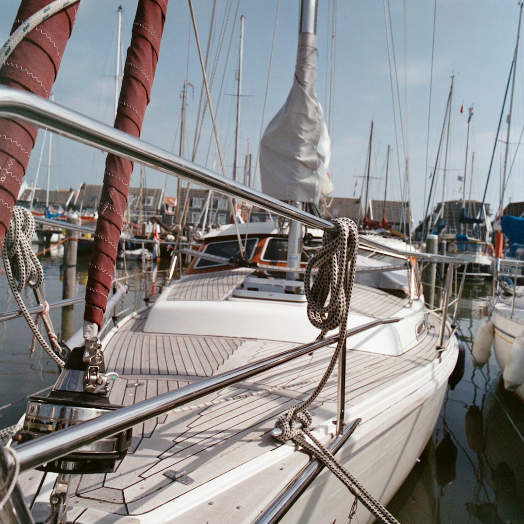 white sailboat on body of water during daytime